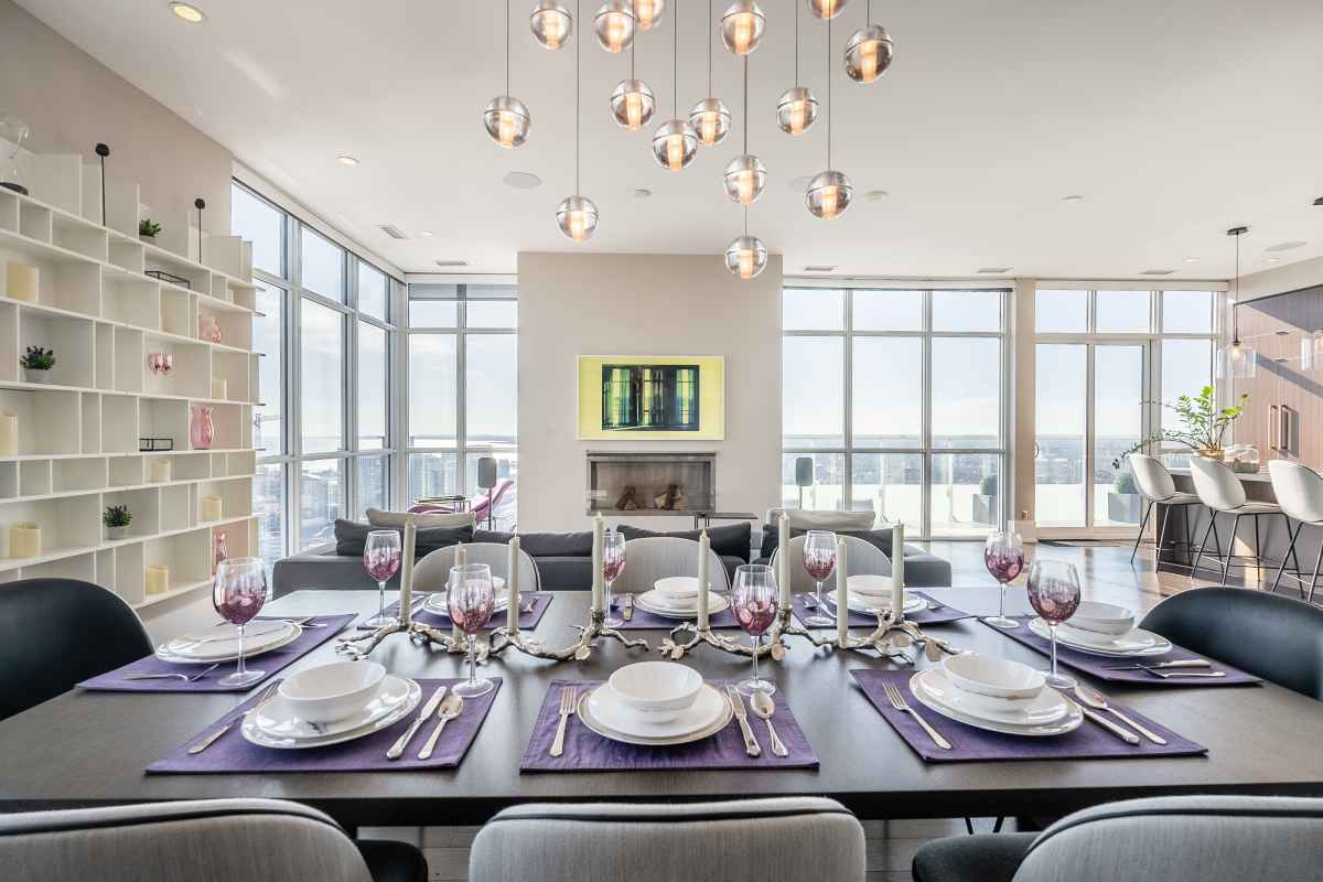 a dining room table set with place settings and place settings