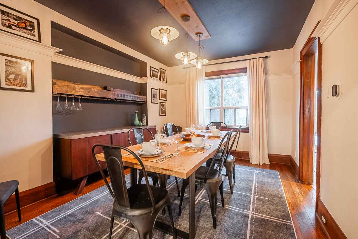 a dining room with a table and chairs