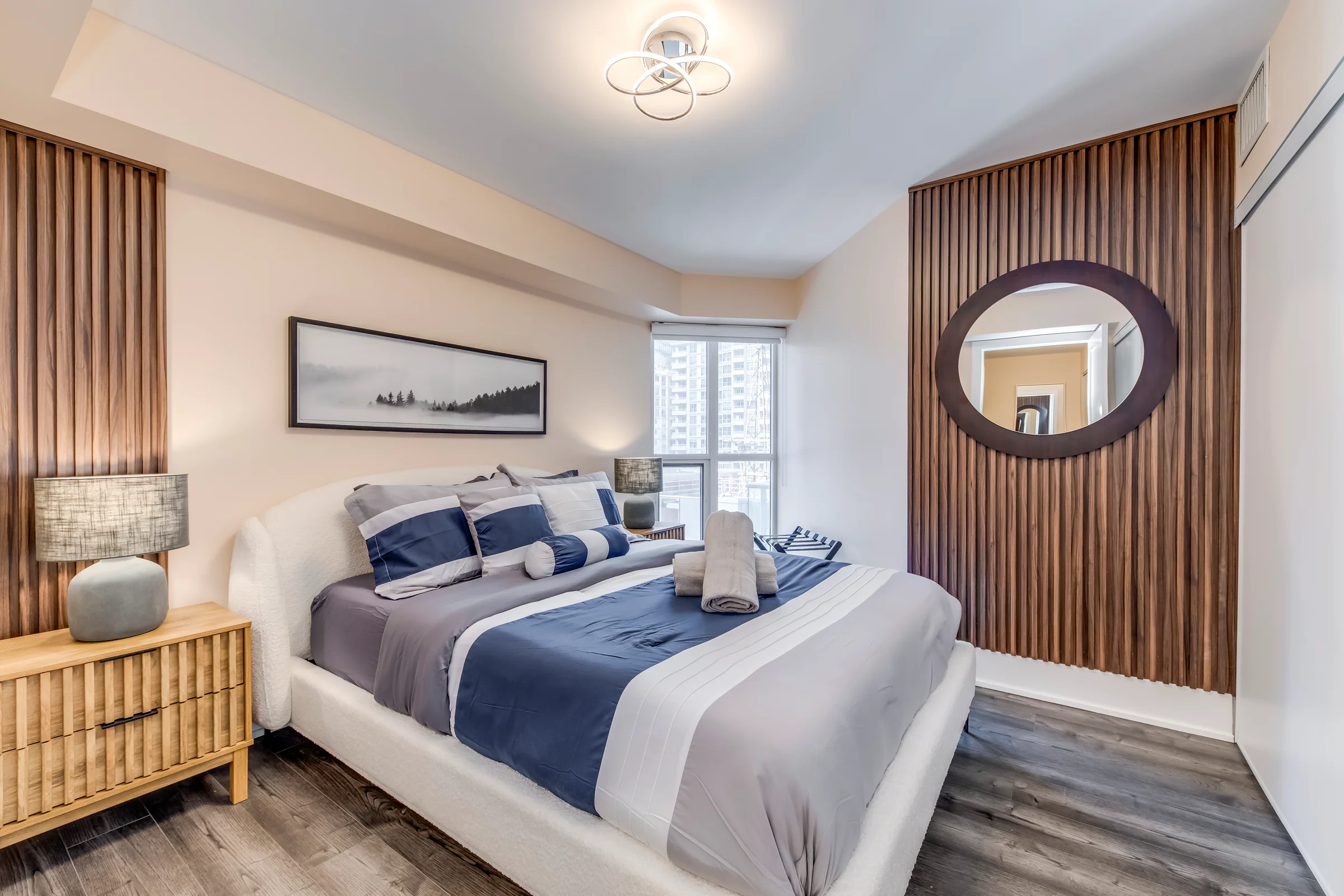 Open living and dining with natural light in a professionally furnished HSG-managed short-term rental in Toronto