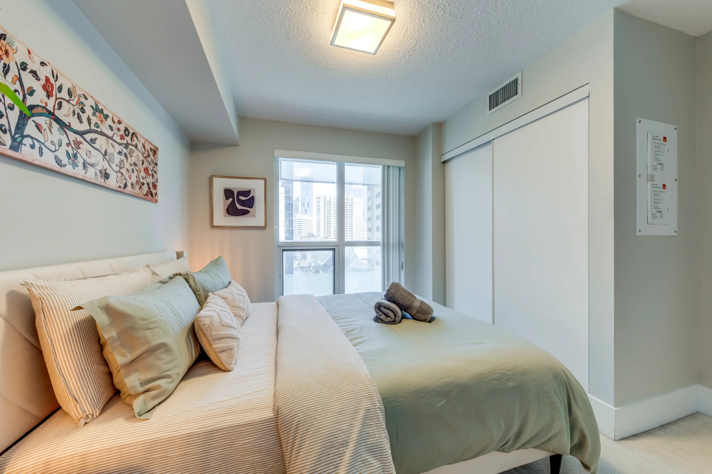 Spacious furnished living and dining in a downtown Toronto executive rental for extended stays, managed by Host Services Group