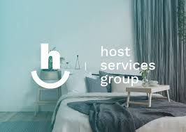 a bed room with a neatly made bed and curtains